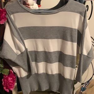 Grey and white stripped sweater.